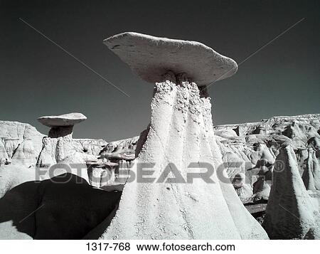 Hoodoo rock formations in a desert, Ah-Shi-Sle-Pah Badlands, New Mexico, USA View Large Photo Image Stock Photo - Hoodoo rock formations in a desert, Ah-Shi-Sle-Pah Badlands, New Mexico, USA. Fotosearch