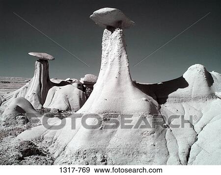 Hoodoo rock formations in a desert, Ah-Shi-Sle-Pah Badlands, New Mexico, USA View Large Photo Image Stock Photo - Hoodoo rock formations in a desert, Ah-Shi-Sle-Pah Badlands, New Mexico, USA. Fotosearch