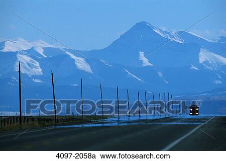 Jeep on a road with mountains in the background, Rocky Mountains, Alberta, Canada View Large Photo Image Stock Image - Jeep on a road with mountains in the background, Rocky Mountains, Alberta, Canada. Fotosearch