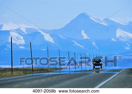 Jeep on a road with mountains in the background, Alberta Highway 22, Rocky Mountains, Alberta, Canada View Large Photo Image Stock Image - Jeep on a road with mountains in the background, Alberta Highway 22, Rocky Mountains, Alberta, Canada. Fotosearch