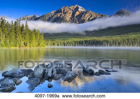 Stock Image - Lake in front of mountains, Pyramid Lake, Pyramid Mountain, Jasper National Park, Alberta, Canada. Fotosearch