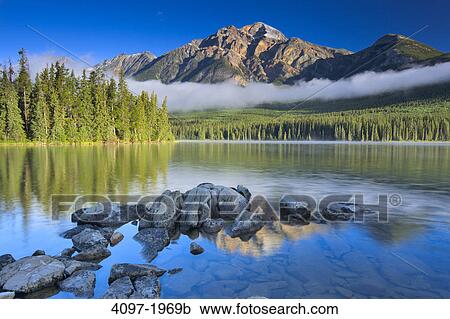 Lake in front of mountains, Pyramid Lake, Pyramid Mountain, Jasper National Park, Alberta, Canada View Large Photo Image Stock Image - Lake in front of mountains, Pyramid Lake, Pyramid Mountain, Jasper National Park, Alberta, Canada. Fotosearch