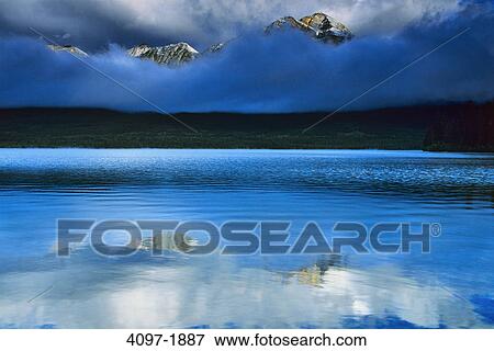 Lake in front of mountains, Pyramid Lake, Pyramid Mountain, Jasper National Park, Alberta, Canada View Large Photo Image Stock Photo - Lake in front of mountains, Pyramid Lake, Pyramid Mountain, Jasper National Park, Alberta, Canada. Fotosearch