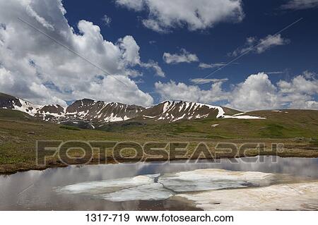 Stock Photo - Lake with mountains in the background, Independence Pass, Rocky Mountains, Aspen, Colorado, USA. Fotosearch