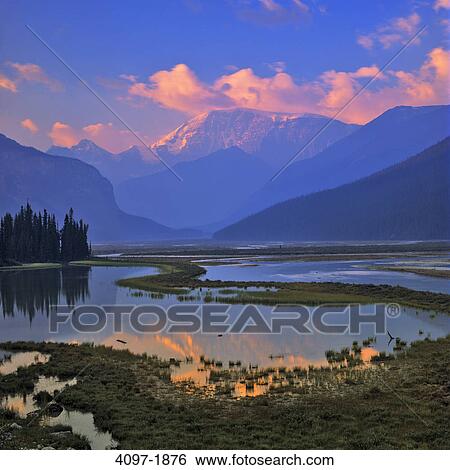 Stock Photograph - Lake with mountains in the background, Jasper National Park, Alberta, Canada. Fotosearch