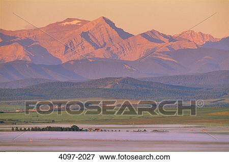 Landscape with mountains in the background, Rocky mountains, Alberta, Canada View Large Photo Image Stock Photo - Landscape with mountains in the background, Rocky mountains, Alberta, Canada. Fotosearch