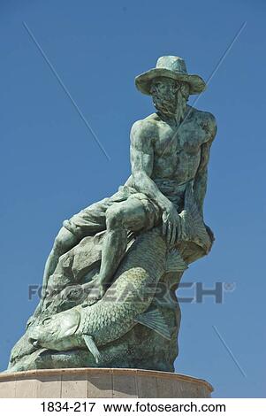 Stock Photo - Low angle view of a fisherman's statue, El Pescador, Monument To The Fisherman, Guaymas, Sonora, Gulf of California, Mexico. Fotosearch