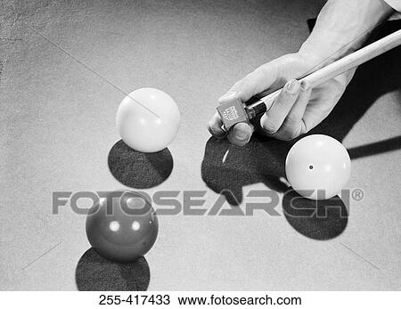 Man applying billiard chalk to tip of cue View Large Photo Image Stock Image - Man applying billiard chalk to tip of cue. Fotosearch