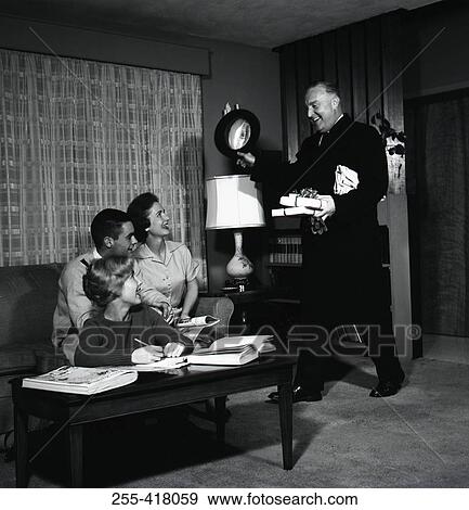 Stock Photo - Man bringing gifts. Fotosearch