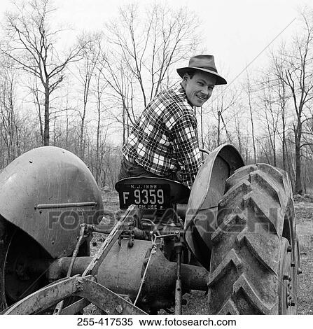 Man driving tractor View Large Photo Image Stock Photography - Man driving tractor. Fotosearch
