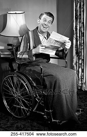 Man in wheelchair reading letter View Large Photo Image Picture - Man in wheelchair reading letter. Fotosearch