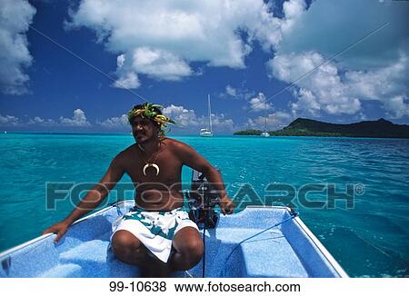 Stock Photo - Man rowing a boat, Bora Bora, Tahiti, French Polynesia. Fotosearch