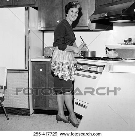Mature housewife cooking View Large Photo Image Stock Photo - Mature housewife cooking. Fotosearch