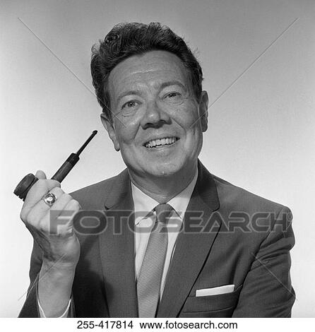 Mature man holding pipe and smiling View Large Photo Image Picture - Mature man holding pipe and smiling. Fotosearch