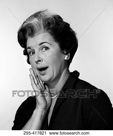 Stock Image - Mature woman with surprised expression. Fotosearch