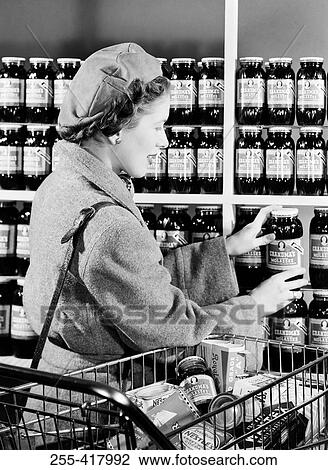 Mid adult woman shopping View Large Photo Image Stock Image - Mid adult woman shopping. Fotosearch