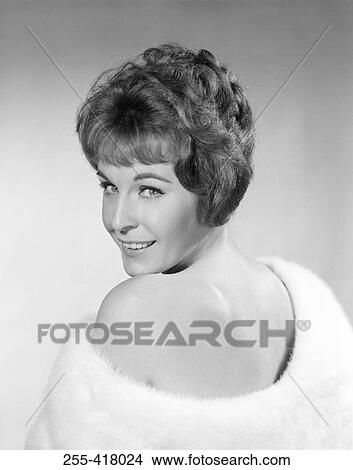 Picture - Mid adult woman wearing shawl smiling. Fotosearch