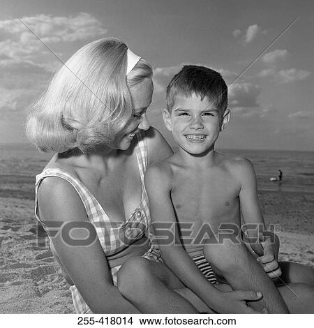 Picture - Mother and son on beach. Fotosearch