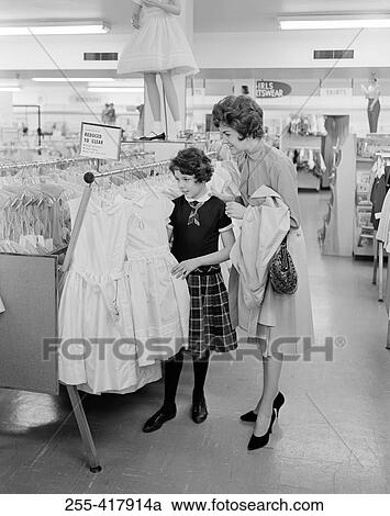 Mother with daughter choosing dress View Large Photo Image Stock Image - Mother with daughter choosing dress. Fotosearch