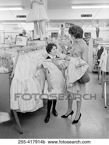 Mother with daughter choosing dress View Large Photo Image Stock Image - Mother with daughter choosing dress. Fotosearch