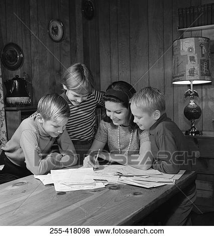 Mother with sons doing homework View Large Photo Image Stock Photo - Mother with sons doing homework. Fotosearch
