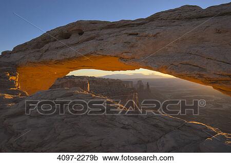 Stock Image - Natural arch in a canyon, Mesa Arch, Island In The Sky, Canyonlands National Park, Utah, USA. Fotosearch