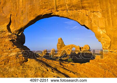 Natural arches in a canyon, Turret Arch, The Windows, Arches National Park, Utah, USA View Large Photo Image Stock Image - Natural arches in a canyon, Turret Arch, The Windows, Arches National Park, Utah, USA. Fotosearch