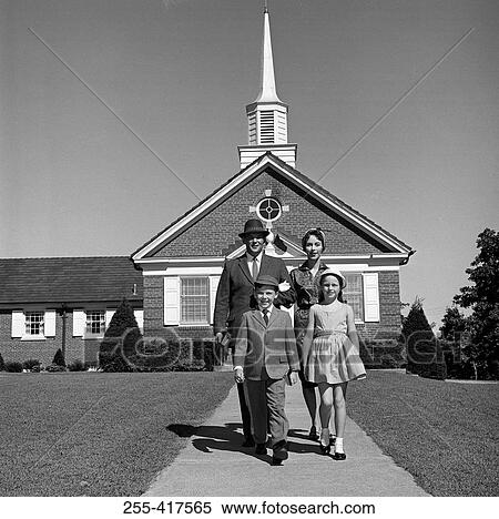 Stock Photography - Parents and kids in front of church. Fotosearch