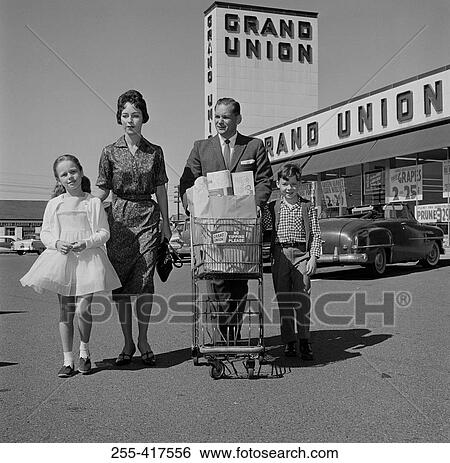 Parents and kids walking across supermarket parking lot with shopping View Large Photo Image Stock Photograph - Parents and kids walking across supermarket parking lot with shopping. Fotosearch