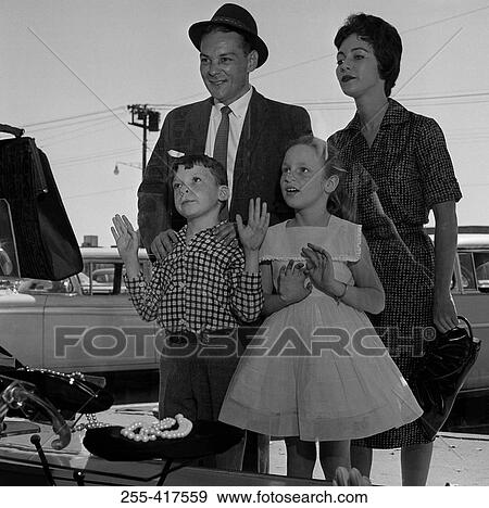 Parents and kids window-shopping View Large Photo Image Stock Photo - Parents and kids window-shopping. Fotosearch