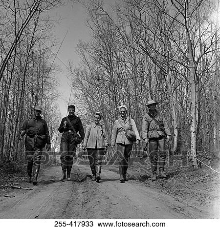 Party of friends with fishing rods on dirt road View Large Photo Image Stock Image - Party of friends with fishing rods on dirt road. Fotosearch