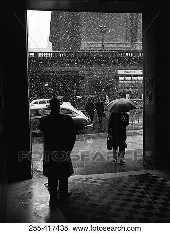 Pedestrians in rain View Large Photo Image Stock Photography - Pedestrians in rain. Fotosearch