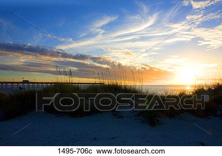 Stock Image - Pier on the beach at sunset, Venice Fishing Pier, Venice Beach, Venice, Gulf Of Mexico, Sarasota County, Florida, USA. Fotosearch