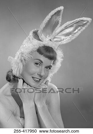 Pin-up girl wearing bunny costume View Large Photo Image Stock Image - Pin-up girl wearing bunny costume. Fotosearch