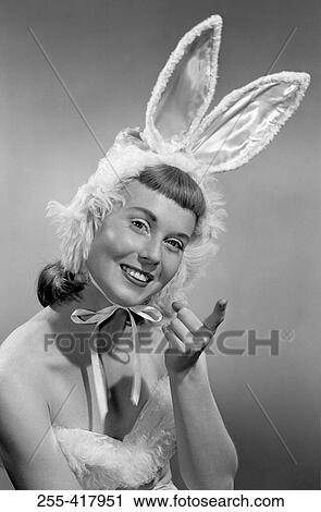 Pin-up girl wearing bunny costume View Large Photo Image Stock Image - Pin-up girl wearing bunny costume. Fotosearch