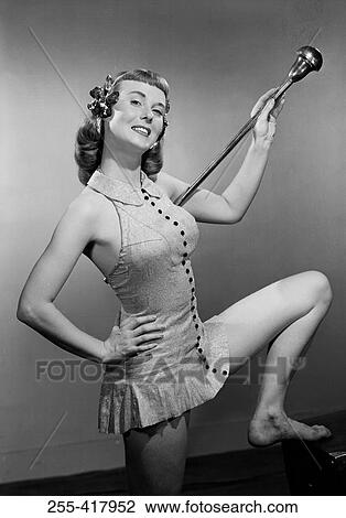 Stock Image - Pin-up girl with stick. Fotosearch