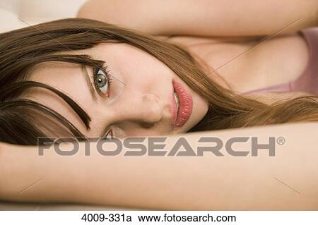 Stock Image - Portrait of a woman posing, Manhattan, New York City, New York State, USA. Fotosearch