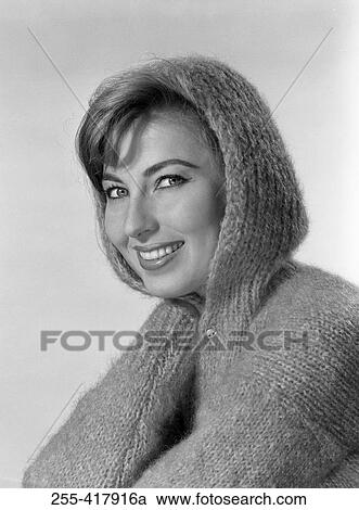 Portrait of beautiful young woman wearing wooly hooded jumper View Large Photo Image Stock Image - Portrait of beautiful young woman wearing wooly hooded jumper. Fotosearch