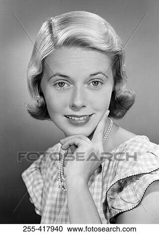 Stock Image - Portrait of beautiful young woman. Fotosearch