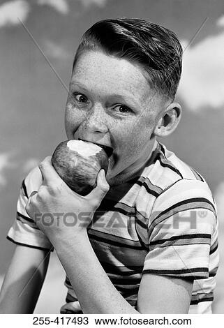 Portrait of boy eating apple View Large Photo Image Stock Image - Portrait of boy eating apple. Fotosearch