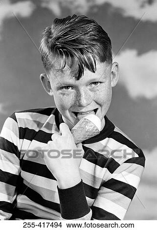 Picture - Portrait of boy eating ice cream. Fotosearch