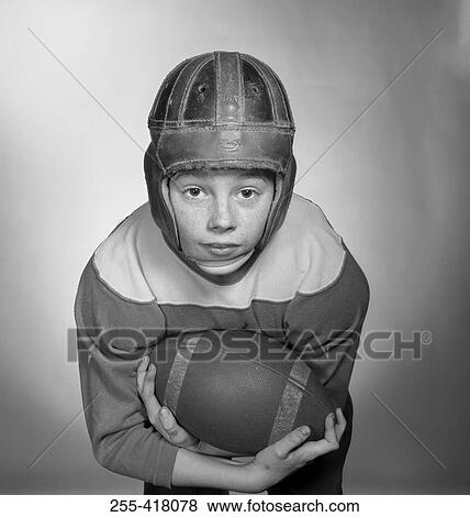 Stock Photo - Portrait of boy in baseball clothes. Fotosearch
