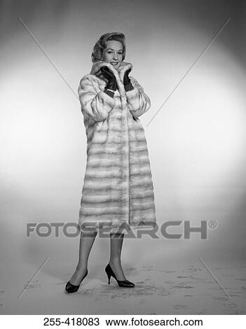 Stock Image - Portrait of elegant woman wearing fur. Fotosearch