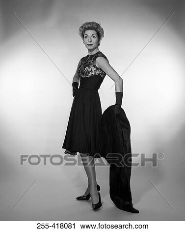 Stock Image - Portrait of elegant woman wearing evening dress. Fotosearch