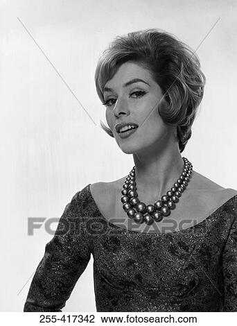 Stock Image - Portrait of elegant young woman smiling. Fotosearch