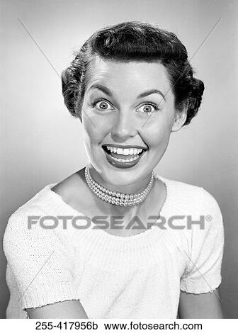 Stock Image - Portrait of exhilarated young woman. Fotosearch