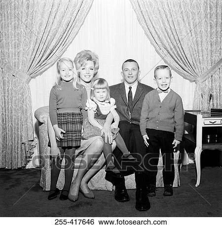 Portrait of family with children in living room View Large Photo Image Stock Photograph - Portrait of family with children in living room. Fotosearch
