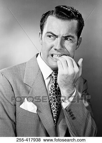 Stock Photo - Portrait of frustrated mid adult businessman. Fotosearch