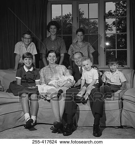 Portrait of large family with children in living room View Large Photo Image Picture - Portrait of large family with children in living room. Fotosearch