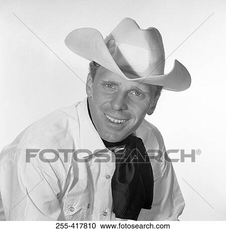 Portrait of man in cowboy hat, studio shot View Large Photo Image Stock Image - Portrait of man in cowboy hat, studio shot. Fotosearch